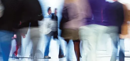 Abstract image of blurred people walking